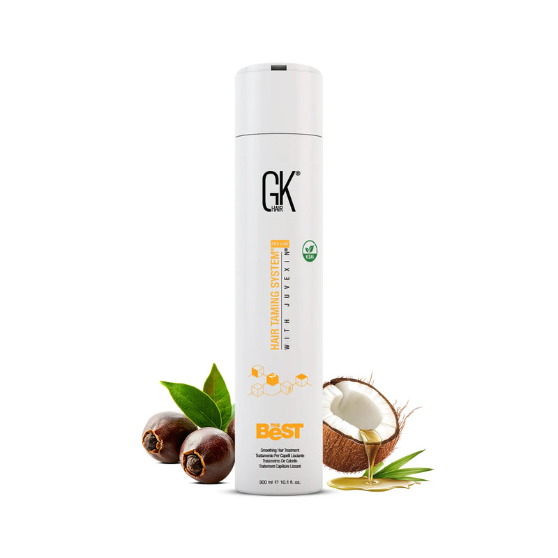 GK Hair The Best smoothing hair treatment in a white 300 ml bottle, with nuts, green leaves and a cracked coconut dripping oil