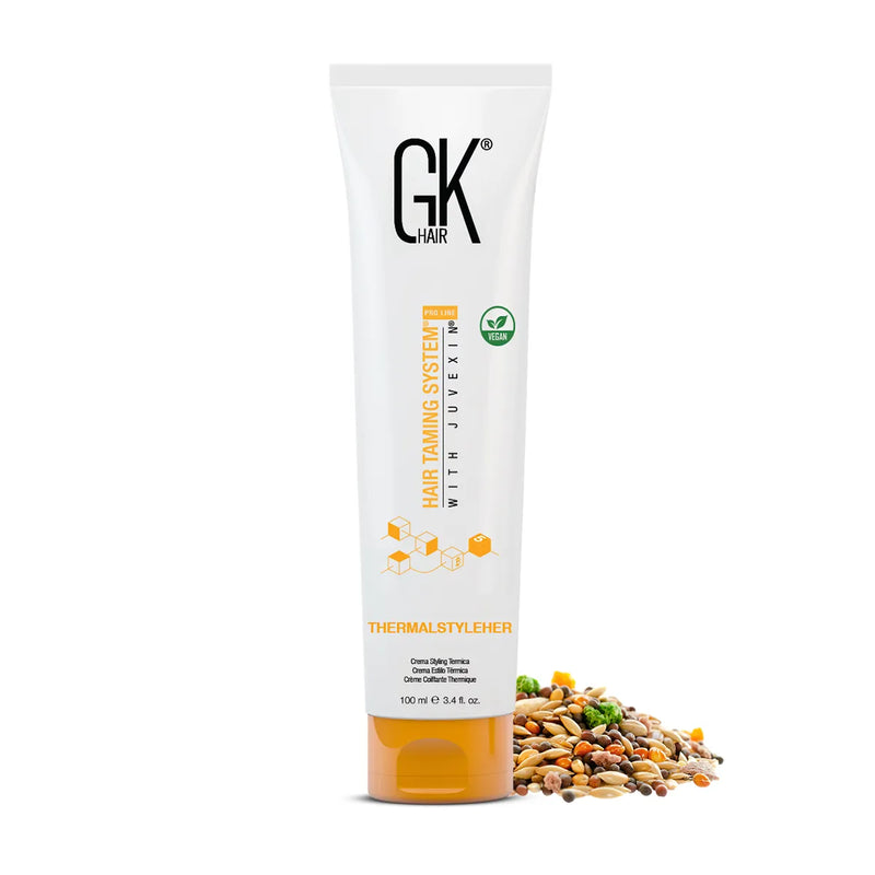ThermalStyleHer Cream 100 ml tube, vegan-badged Hair Taming System with Juvexin label, upright on white by scattered seeds