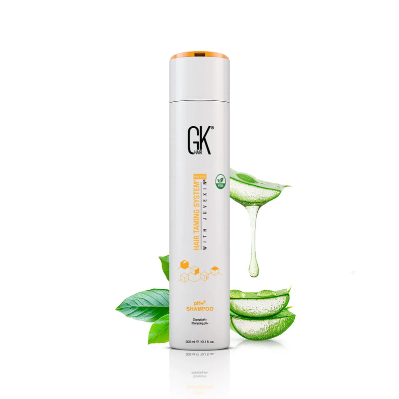 GK Hair pH+ Shampoo bottle, Hair Taming System with Juvexin, 300 ml / 10.1 fl. oz., beside aloe vera leaves with dripping gel