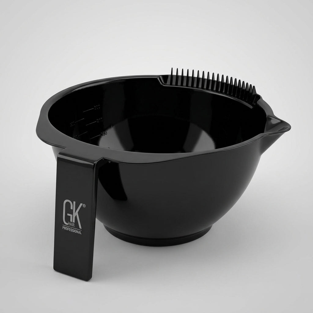 Black GK Hair Professional mixing bowl seen at an angle, with comb-tooth rim, pour spout and logo-stamped handle